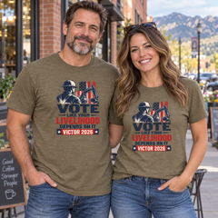 Colorado lifestyle - construction graphic, Heather Olive T-shirts worn by a man and woman in a Colorado town