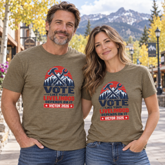 Colorado lifestyle - trades graphic, Heather Olive T-shirts worn by a man and woman in a Colorado town