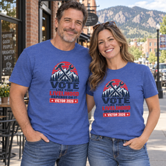 Colorado lifestyle - trades graphic, Heather True Royal T-shirts worn by a man and woman in a Colorado town